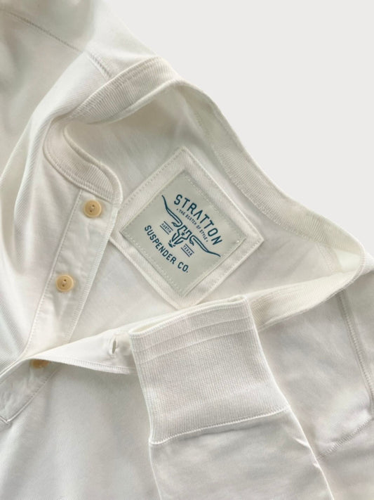 Close-up of Vintage 1940s White Heavyweight Henley by Stratton Suspender Co., highlighting the ribbed sleeve cuff, three-button placket, and embroidered brand label. Made in the USA from premium heavyweight cotton for durability and classic heritage workwear style.