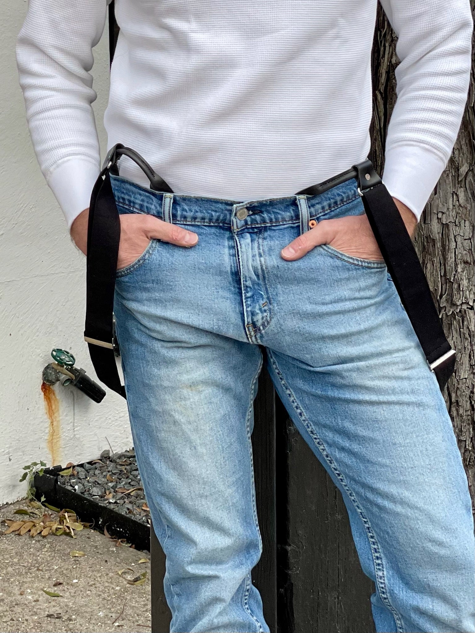 Close-up of a vintage 1940s heavyweight white waffle knit thermal shirt paired with black suspenders and vintage Levi’s denim. A rugged workwear-inspired look featuring ethically made American craftsmanship. Made in the USA by Stratton Suspender Co.