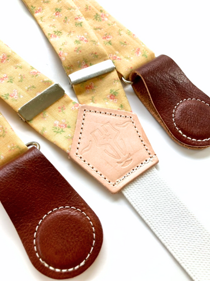 Vintage Blossom Yellow women’s floral suspenders with leather magnetic clasps, handmade in Texas.