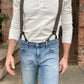 Close-up of a man wearing a Vintage White Henley and brown wool suspenders by Stratton Suspender Co., styled with classic denim. A heritage workwear look combining rugged craftsmanship with timeless American menswear.