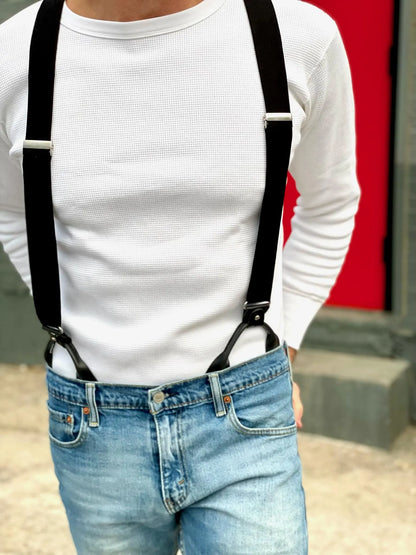 Vintage black linen suspenders with button-on black leather ends, styled with a white waffle knit shirt and light wash denim jeans. Handmade by Stratton Suspender Co., heritage menswear made in Texas.