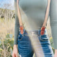 Women's Magnetic Suspenders in Nutmeg Brown with Cognac Leather – Cute Vintage-Inspired Accessory by Stratton Suspender Co. – Styled with Olive Green Top and Denim Jeans for Casual Austin Texas Street Style.