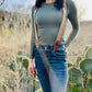Women's Magnetic Suspenders in Nutmeg Brown with Cognac Leather – Cute Vintage-Inspired Accessory by Stratton Suspender Co. – Styled with Olive Green Top and Denim Jeans for Effortless Western Chic Style.