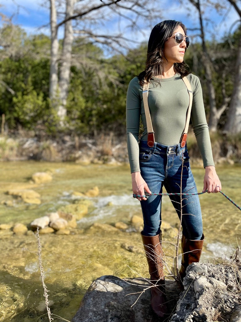 Women’s suspenders with magnetic clasps for fall and year-round outfits, outdoor Texas lifestyle setting.
