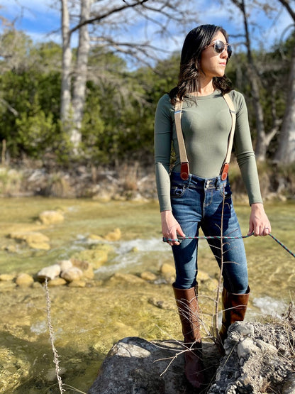 Women’s suspenders with magnetic clasps for fall and year-round outfits, outdoor Texas lifestyle setting.