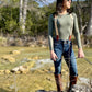 Heritage-inspired women’s suspenders styled with boots, jeans, and long sleeve top for outdoor outfit