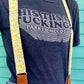 Magnetic clasp suspenders for women styled casually with high-waisted jeans and tee