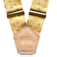 Back patch detail of yellow floral women’s suspenders with polished hardware, handmade in the USA.
