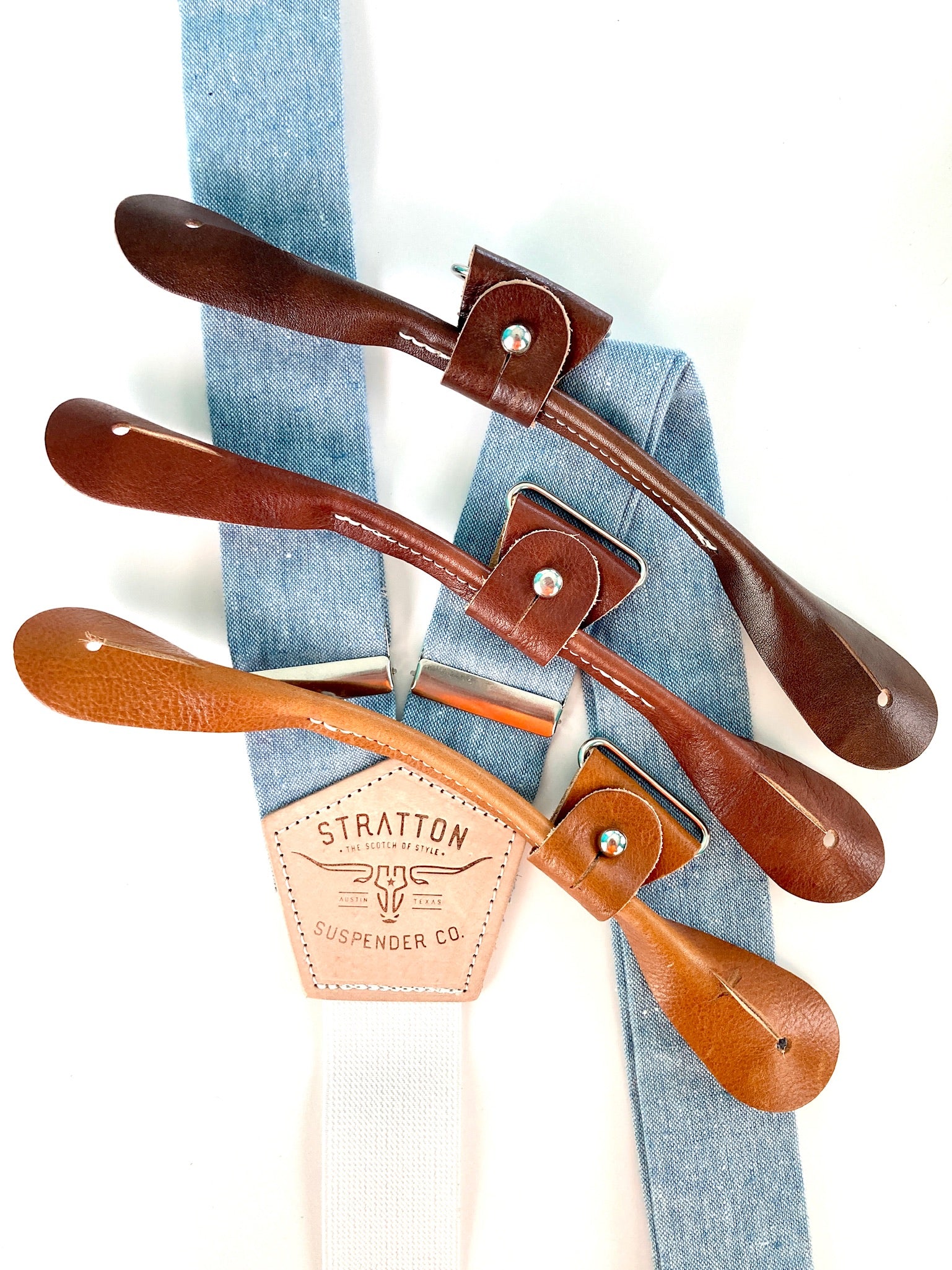 Stratton Suspender Co. Button On Set in Frio River Blue Linen featuring Tan, Cognac, Chocolate, and Black Italian Pontedero Leather