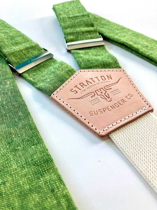 Stratton Suspender Co. features the Spruce bright green linen suspenders on veg tan shoulder leather with cream colored elastic back strap for the Fall 2022 suspenders collection 