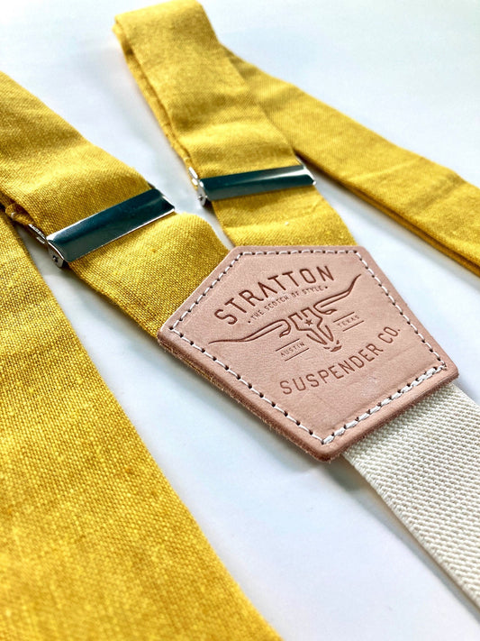 Stratton Suspender Co. features the Yellow linen suspenders on veg tan shoulder leather with cream colored elastic back strap for the Fall 2022 suspenders collection 