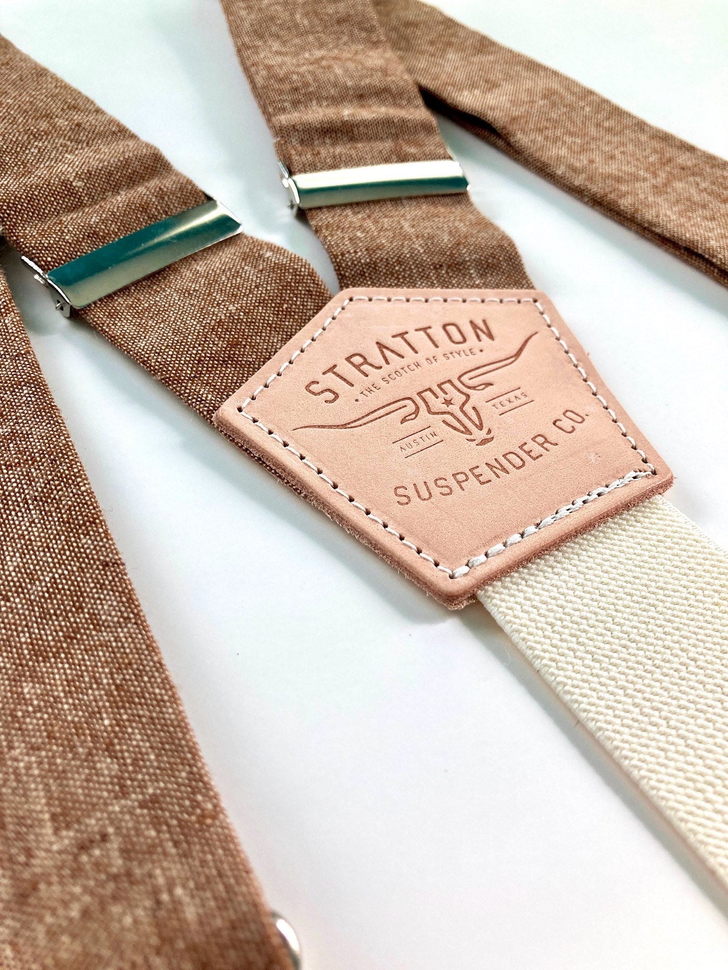 Stratton Suspender Co. feature the new fall collection suspenders in Nutmeg (brown) linen stitched onto vegtan shoulder leather with cream colored elastic