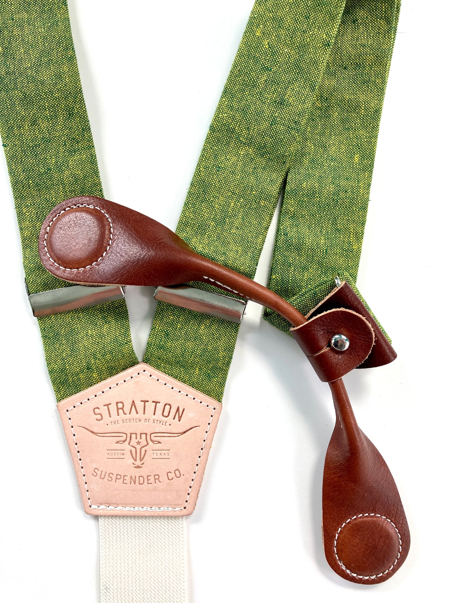 Stratton Suspender Co. features the Palm green with yellow woven threaded linen suspenders on veg tan shoulder leather with cream colored elastic back strap for the Fall 2022 suspenders collection Magnetic Stratton Suspender clasps in Cognac Pontedero Italian leather hand-picked by Stratton Suspender Co.