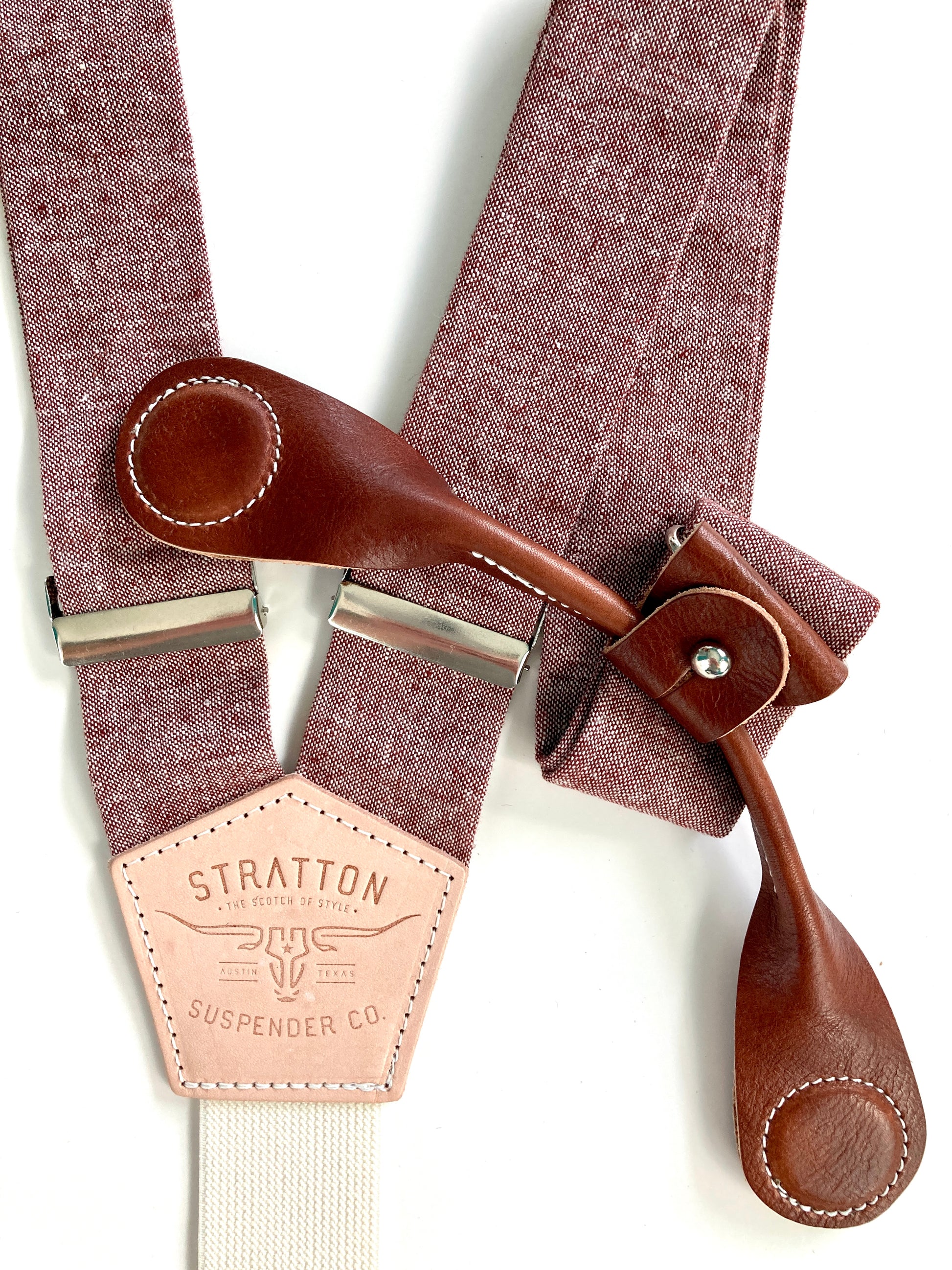Stratton Suspender Co. features the Rust (Maroon) linen suspenders on veg tan shoulder leather with cream colored elastic back strap for the Fall 2022 suspenders collection Magnetic Stratton Suspender clasps in Cognac Pontedero Italian leather hand-picked by Stratton Suspender Co.