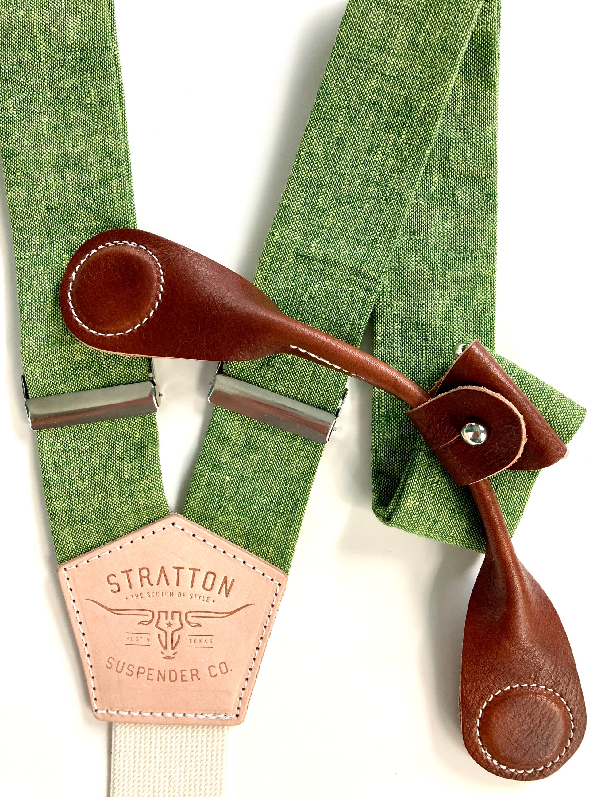 Stratton Suspender Co. features our Spruce (bright green) linen suspenders on veg tan shoulder leather with cream colored elastic back strap for the Fall 2022 suspenders collection Magnetic Stratton Suspender clasps in Cognac Pontedero Italian leather hand-picked by Stratton Suspender Co.