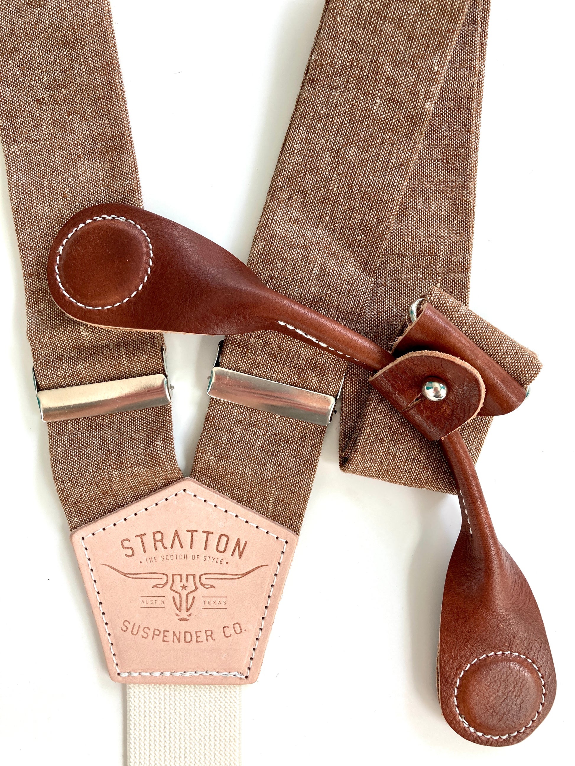 Stratton Suspender Co. features the Nutmeg (brown) linen suspenders on veg tan shoulder leather with cream colored elastic back strap for the Fall 2022 suspenders collection Magnetic Stratton Suspender clasps in Cognac Pontedero Italian leather hand-picked by Stratton Suspender Co.