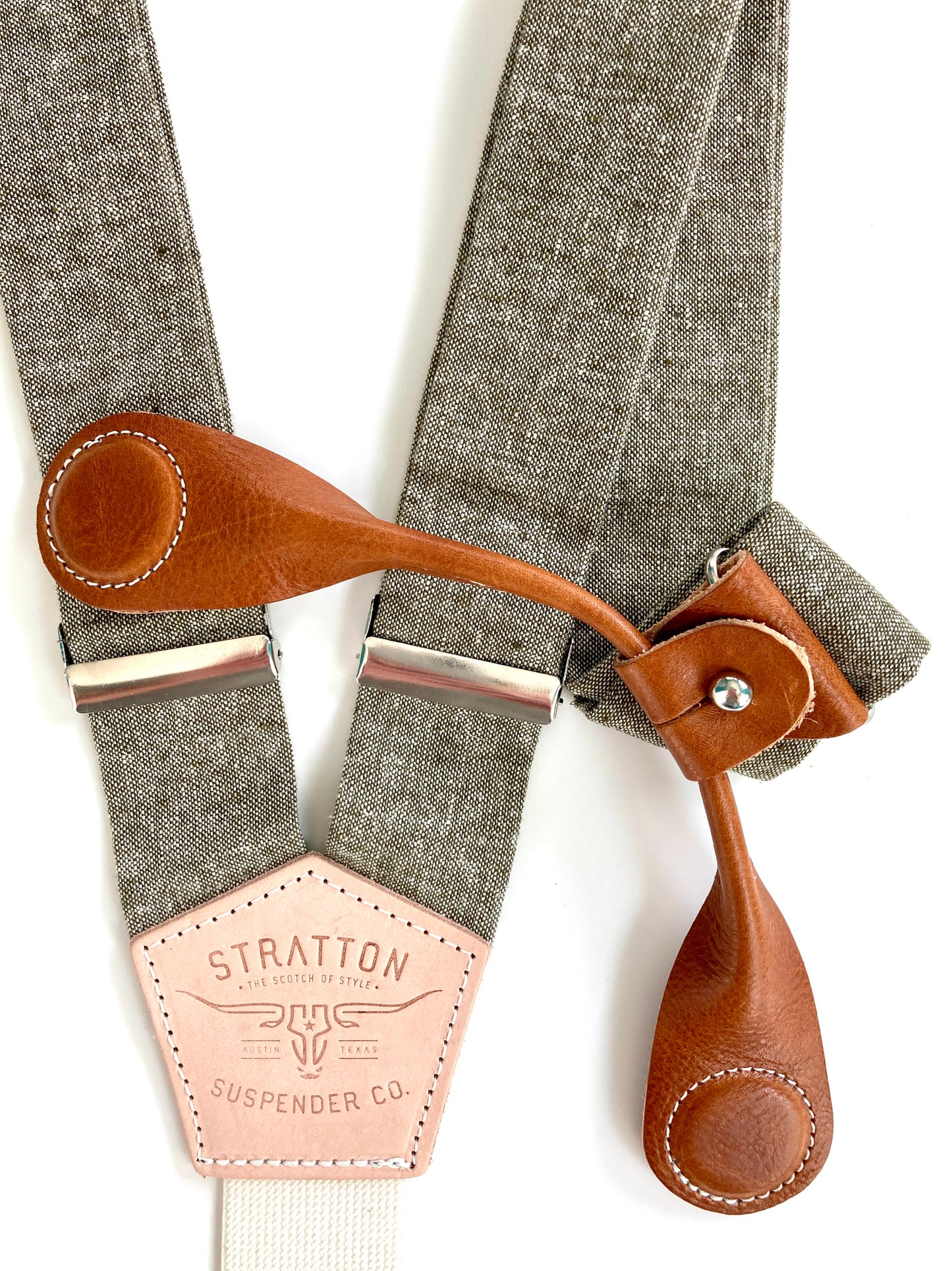 Stratton Suspender Co. features the Olive Green linen suspenders on veg tan shoulder leather with cream colored elastic back strap for the Fall 2022 suspenders collection Magnetic Stratton Suspender clasps in Tan Pontedero Italian leather hand-picked by Stratton Suspender Co.