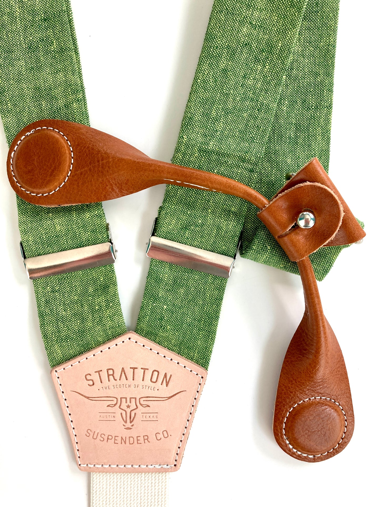 Stratton Suspender Co. features our Spruce (bright green) linen suspenders on veg tan shoulder leather with cream colored elastic back strap for the Fall 2022 suspenders collection Magnetic Stratton Suspender clasps in Tan Pontedero Italian leather hand-picked by Stratton Suspender Co.