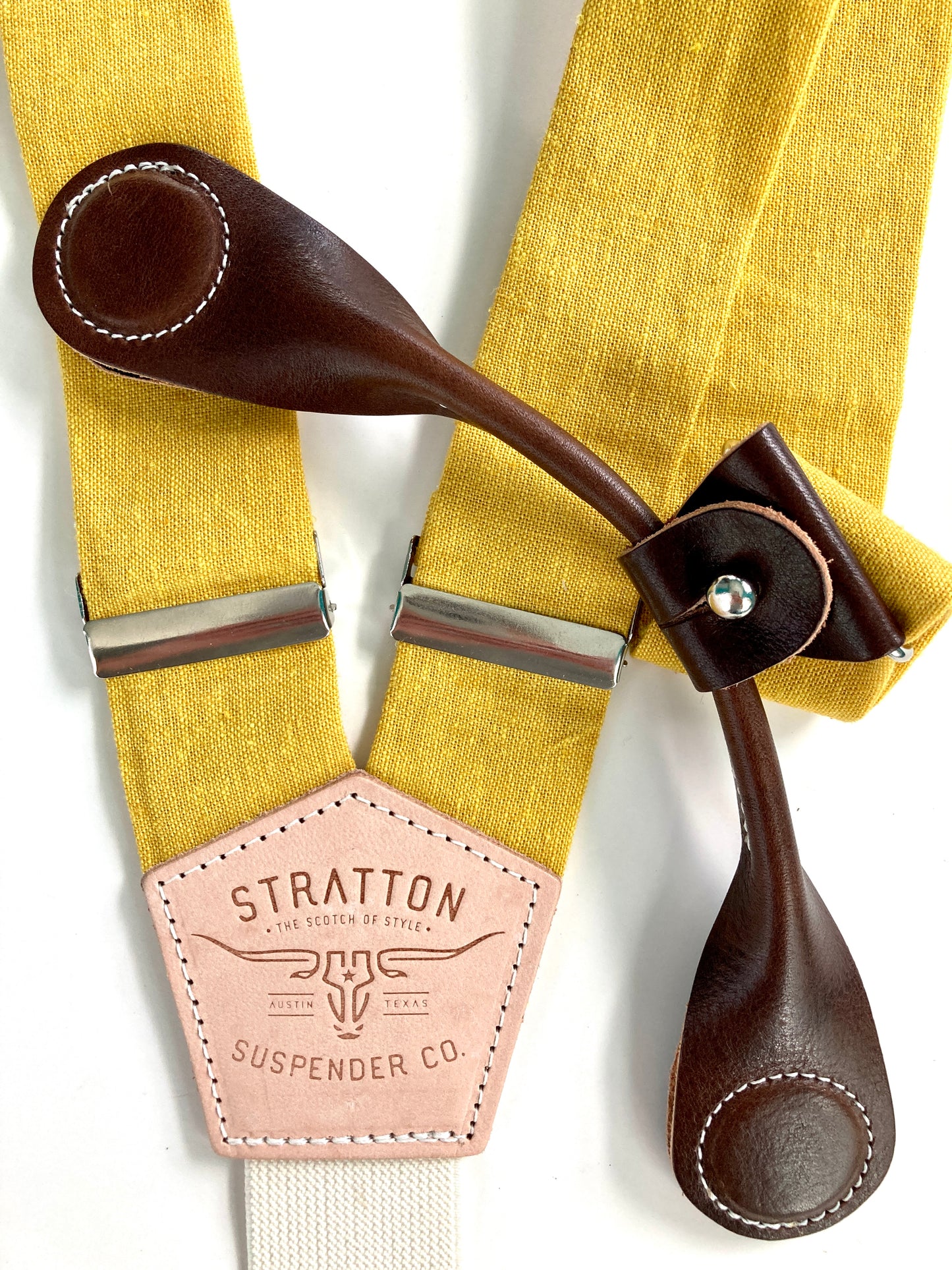 Stratton Suspender Co. features the Yellow linen suspenders on veg tan shoulder leather with cream colored elastic back strap for the Fall 2022 suspenders collection Magnetic Stratton Suspender clasps in Chocolate Pontedero Italian leather hand-picked by Stratton Suspender Co.