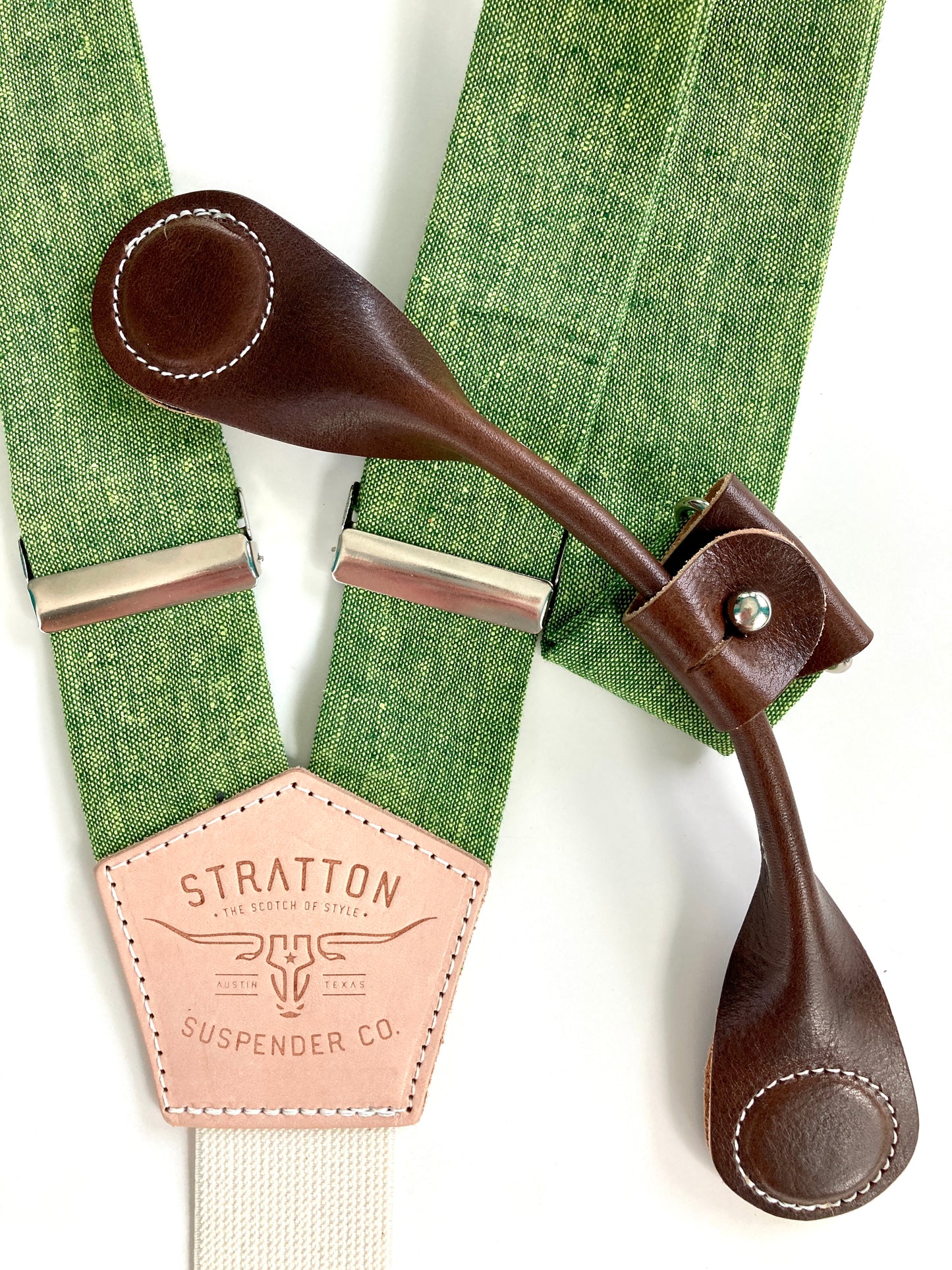 Stratton Suspender Co. features our Spruce (bright green) linen suspenders on veg tan shoulder leather with cream colored elastic back strap for the Fall 2022 suspenders collection Magnetic Stratton Suspender clasps in Chocolate Pontedero Italian leather hand-picked by Stratton Suspender Co