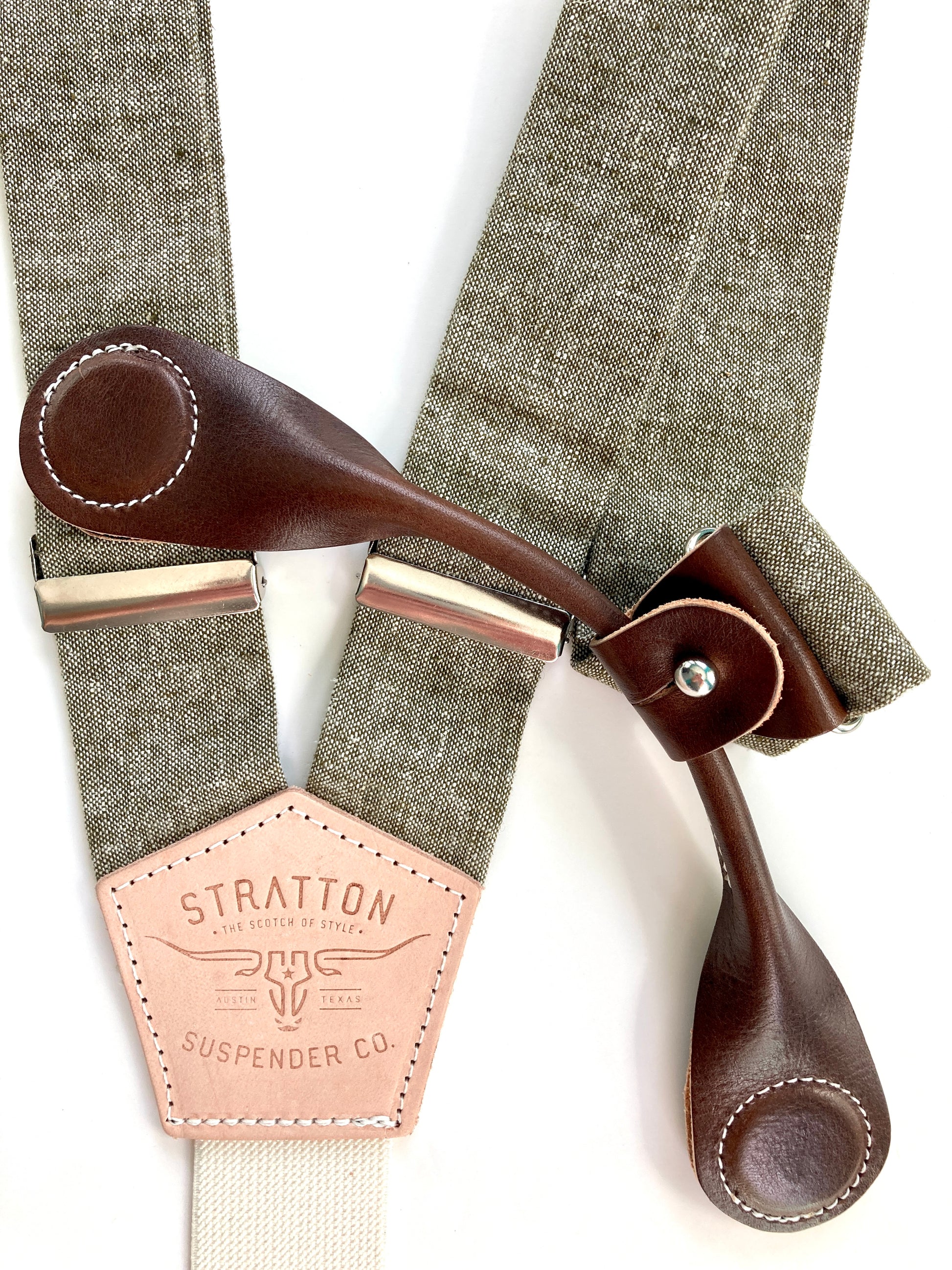 Stratton Suspender Co. features the Olive Green linen suspenders on veg tan shoulder leather with cream colored elastic back strap for the Fall 2022 suspenders collection Magnetic Stratton Suspender clasps in Chocolate Pontedero Italian leather hand-picked by Stratton Suspender Co.