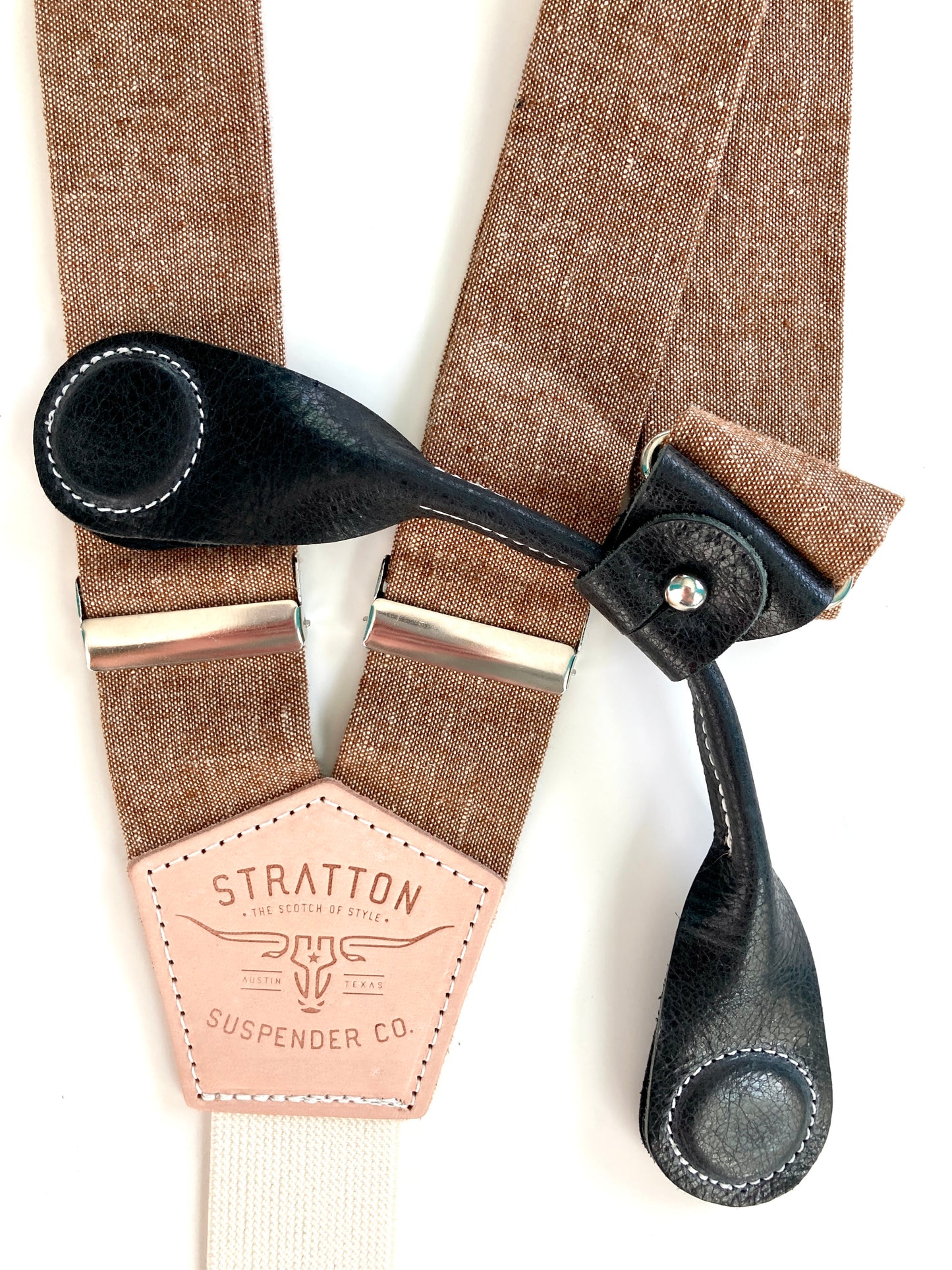 Stratton Suspender Co. features the Nutmeg (brown) linen suspenders on veg tan shoulder leather with cream colored elastic back strap for the Fall 2022 suspenders collection Magnetic Stratton Suspender clasps in Black Pontedero Italian leather hand-picked by Stratton Suspender Co.